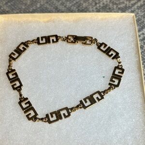 269. Givenchy Gold G link Bracelet with COA